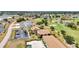 From above, see the buildings, golf course, pond, and other manicured landscaping at 26336 Nadir Rd # 10, Punta Gorda, FL 33983