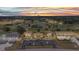 Aerial view of the condos overlooking the beautiful golf course and ponds at sunset at 26336 Nadir Rd # 10, Punta Gorda, FL 33983