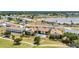 Beautiful aerial view of condo community with a pool and golf course nearby at 26336 Nadir Rd # 10, Punta Gorda, FL 33983