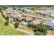 Beautiful aerial view of condo community with a pool and golf course nearby at 26336 Nadir Rd # 10, Punta Gorda, FL 33983