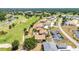 Aerial view showcases the community, landscaping, and golf course at 26336 Nadir Rd # 10, Punta Gorda, FL 33983