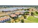 High aerial shot exhibits buildings, golf course, and a large pond at 26336 Nadir Rd # 10, Punta Gorda, FL 33983