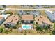 Bird's eye view of three condominiums surrounding community pool and parking at 26336 Nadir Rd # 10, Punta Gorda, FL 33983