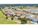 Aerial view showcases the community and nearby golf course at 26336 Nadir Rd # 10, Punta Gorda, FL 33983