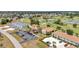 Aerial view shows the community landscaping, parking, and the nearby golf course at 26336 Nadir Rd # 10, Punta Gorda, FL 33983