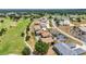 Aerial view showcases the community, landscaping, and golf course at 26336 Nadir Rd # 10, Punta Gorda, FL 33983
