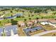 Expansive aerial view showcases the community and golf course surroundings at 26336 Nadir Rd # 10, Punta Gorda, FL 33983
