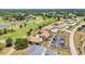 Aerial view showcases the community, golf course, and landscaping at 26336 Nadir Rd # 10, Punta Gorda, FL 33983
