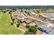Aerial view showcases the community and nearby golf course at 26336 Nadir Rd # 10, Punta Gorda, FL 33983