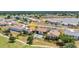 An aerial view of condo with a swimming pool in the backyard on a golf course at 26336 Nadir Rd # 10, Punta Gorda, FL 33983