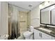 Clean bathroom with tub and shower and modern white vanity at 26336 Nadir Rd # 10, Punta Gorda, FL 33983