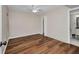 Light and airy bedroom with modern hard wood floors and ceiling fan at 26336 Nadir Rd # 10, Punta Gorda, FL 33983