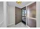 Open front door with storm door and natural light beaming in at 26336 Nadir Rd # 10, Punta Gorda, FL 33983
