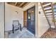 This condo features a quaint front patio with chair and access to stairs for easy access at 26336 Nadir Rd # 10, Punta Gorda, FL 33983