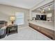 Bright living room with tile floors and a view of the kitchen, providing a comfortable and open living space at 26336 Nadir Rd # 10, Punta Gorda, FL 33983