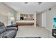 Inviting living room with tile floors that connects to an open kitchen space, perfect for relaxing and entertaining at 26336 Nadir Rd # 10, Punta Gorda, FL 33983