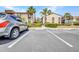 Designated parking area in front of the condominium buildings, providing convenient resident parking at 26336 Nadir Rd # 10, Punta Gorda, FL 33983