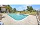 Community pool with lounge chairs and a well-maintained deck, providing a relaxing outdoor oasis at 26336 Nadir Rd # 10, Punta Gorda, FL 33983