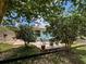 View of the backyard, patio and shed behind a chainlink fence at 2969 Wells Ave, North Port, FL 34286