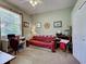 Bedroom with a ceiling fan, and a desk that is next to a window at 2969 Wells Ave, North Port, FL 34286
