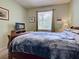 Comfortable bedroom with a large window and wood furniture at 2969 Wells Ave, North Port, FL 34286