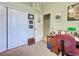 Bedroom featuring a closet, interior door, and desk against a wall at 2969 Wells Ave, North Port, FL 34286