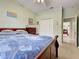 Comfortable bedroom with double closets and a doorway leading to another room at 2969 Wells Ave, North Port, FL 34286