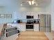 Well-equipped kitchen with stainless steel appliances, white cabinetry, and ample counter space for meal preparation at 2969 Wells Ave, North Port, FL 34286