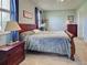 Spacious main bedroom featuring a large bed, soft lighting, and serene decor for a peaceful retreat at 2969 Wells Ave, North Port, FL 34286