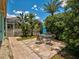 Backyard patio with a table and four chairs and the pool is visible in the background at 2969 Wells Ave, North Port, FL 34286