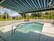 The backyard swimming pool has a screened-in patio for relaxing outside at 2969 Wells Ave, North Port, FL 34286