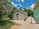 Exterior view of the shed and the yard between the home and the shed at 2969 Wells Ave, North Port, FL 34286