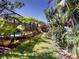 Secluded backyard landscape around the screened-in pool providing tranquil scenery at 421 Marsh Creek Rd, Venice, FL 34292
