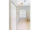 Bright bathroom featuring tile flooring, white cabinets, and a walk-in shower with gold trim at 421 Marsh Creek Rd, Venice, FL 34292