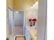 Bathroom featuring double vanity, large mirror and entry to the bedroom at 421 Marsh Creek Rd, Venice, FL 34292