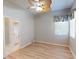 Bedroom featuring light-colored wood floors and access to an ensuite bathroom at 421 Marsh Creek Rd, Venice, FL 34292