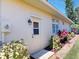 Home exterior features a convenient side entrance and manicured landscaping at 421 Marsh Creek Rd, Venice, FL 34292
