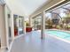 This lanai features an outdoor pool, patio furniture and screened windows at 421 Marsh Creek Rd, Venice, FL 34292
