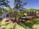 Lush landscaping complementing the screened-in pool offering a serene backyard retreat at 421 Marsh Creek Rd, Venice, FL 34292