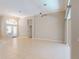 Spacious living room with tile flooring, neutral paint, archway and plenty of natural light at 421 Marsh Creek Rd, Venice, FL 34292