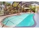 Inviting screened-in pool area, perfect for relaxation and entertainment, with mature trees around it at 421 Marsh Creek Rd, Venice, FL 34292