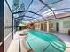 Beautiful screened-in pool and patio area with ample space for seating and entertaining near the home at 421 Marsh Creek Rd, Venice, FL 34292