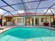 Clear view of screened-in pool highlighting the seamless indoor-outdoor living with direct access to the home at 421 Marsh Creek Rd, Venice, FL 34292