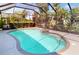 Refreshing screened-in pool and patio area, ideal for outdoor enjoyment, complete with a spa at 421 Marsh Creek Rd, Venice, FL 34292