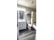 Bathroom features a vanity with a sink, a toilet, and a shower with a tub at 426 Ricold Ter, Port Charlotte, FL 33954