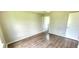 This bedroom features hardwood floors and neutral walls, offering a versatile space at 426 Ricold Ter, Port Charlotte, FL 33954