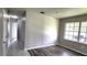 Bedroom features wood-look floors, neutral walls, and a window for plenty of natural light at 426 Ricold Ter, Port Charlotte, FL 33954
