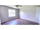 Bedroom with ceiling fan, laminate flooring, and natural light at 426 Ricold Ter, Port Charlotte, FL 33954