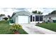 Charming one-story home featuring a one-car garage, enclosed lanai, and well-maintained lawn at 426 Ricold Ter, Port Charlotte, FL 33954
