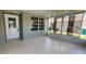 Spacious screened-in lanai with neutral walls and flooring, perfect for relaxing or entertaining at 426 Ricold Ter, Port Charlotte, FL 33954